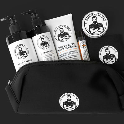A gift box with everything a man needs. Hand repair cream, hair and body wash, face wash, hand cleaner, lip balm, stubby holder and toiletry bag.